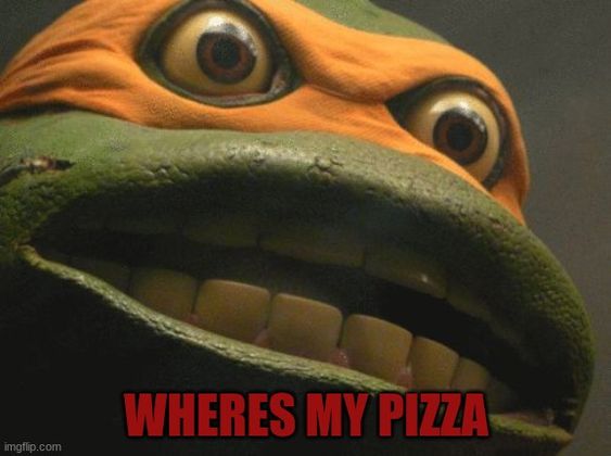 a close-up of Michelangelo from the 90s movies. text at the bottom reads 'where's my pizza'